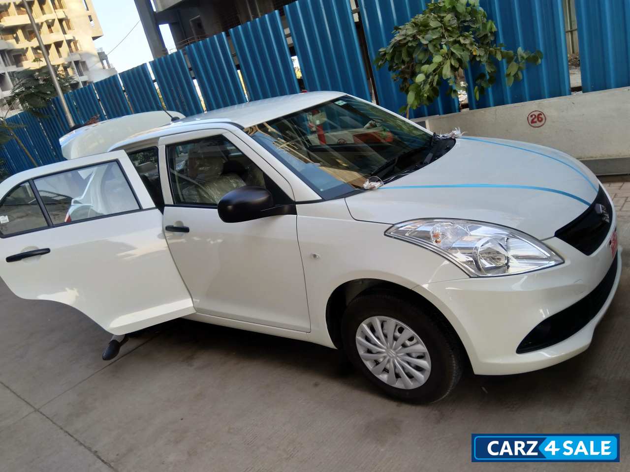 Pearl White Maruti Suzuki Swift DZire