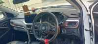White Maruti Suzuki Brezza ZXI smart hybrid