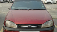 Maroon Ford Ikon
