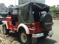 Red Mahindra Jeep